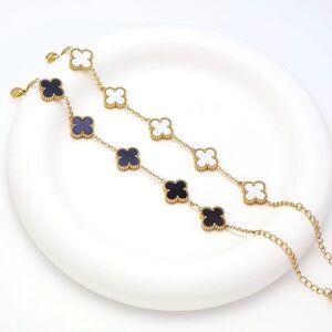 Elegant Gold and Black Clover Bracelet